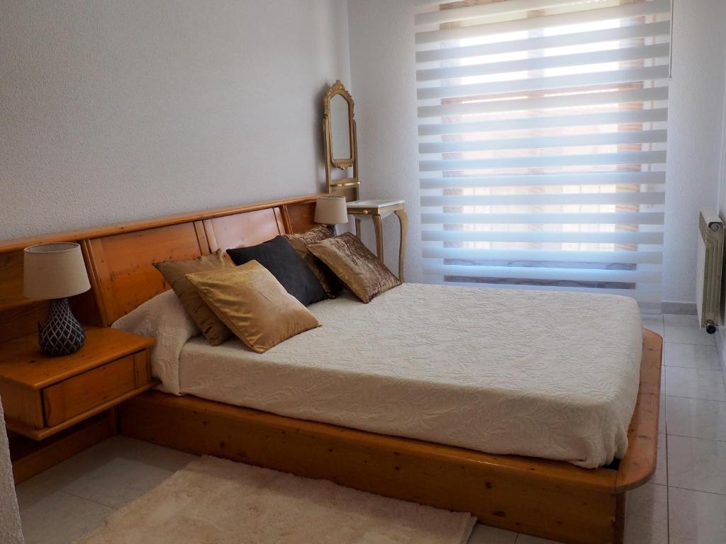 A bed or beds in a room at Apartamento Turístico Duero Niño