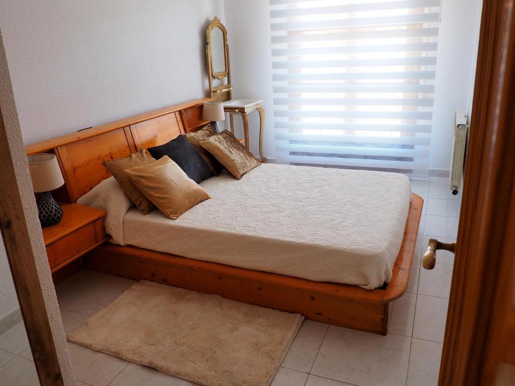 A bed or beds in a room at Apartamento Turístico Duero Niño