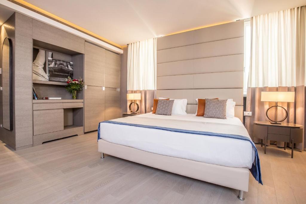 Postel nebo postele na pokoji v ubytování Orazio Palace Hotel