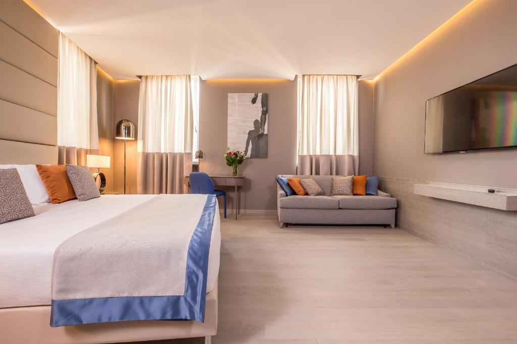 Postel nebo postele na pokoji v ubytování Orazio Palace Hotel