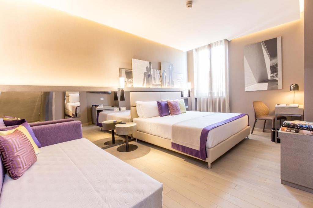 Postel nebo postele na pokoji v ubytování Orazio Palace Hotel