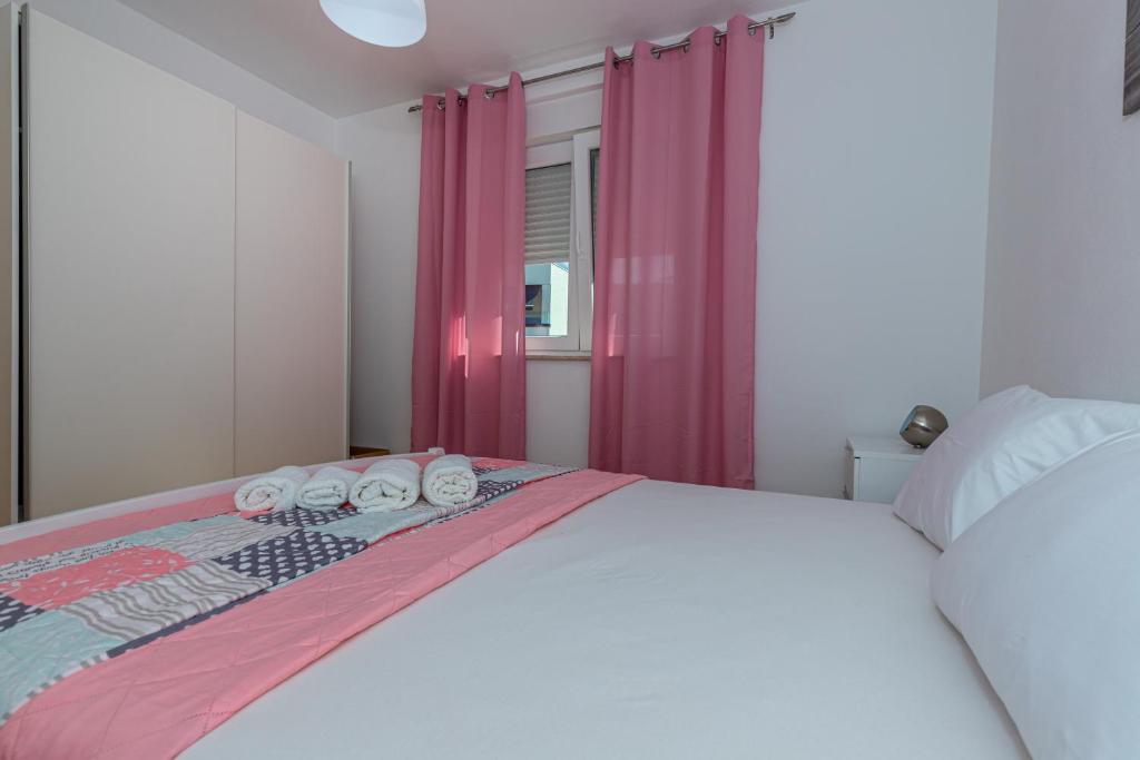 Postel nebo postele na pokoji v ubytování Apartmani Relax