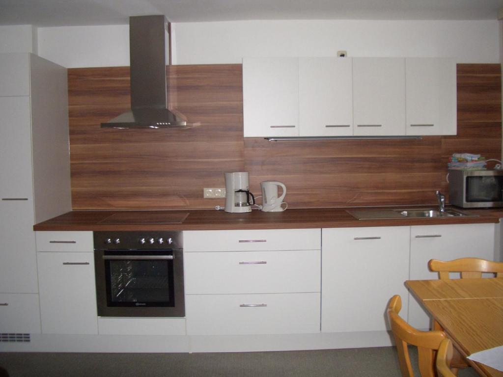 Kuchyň nebo kuchyňský kout v ubytování Ferienhaus Troy