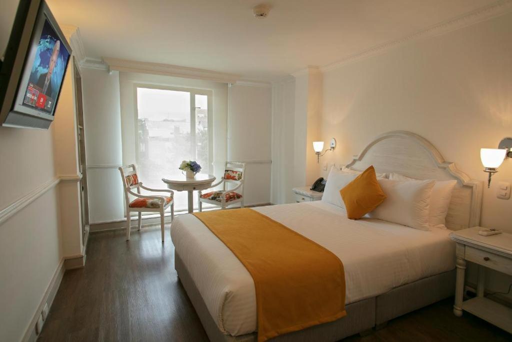 Un pat sau paturi într-o cameră la Hotel Vintage