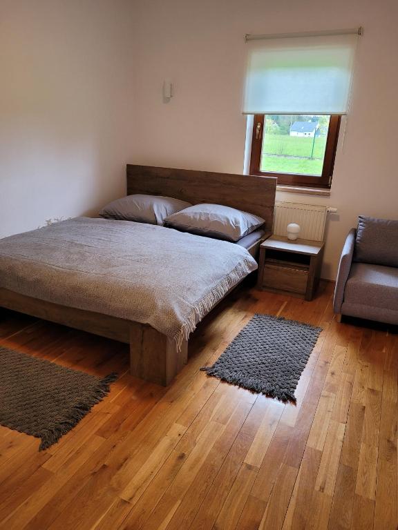 Postel nebo postele na pokoji v ubytování Apartmány Velké Dářko