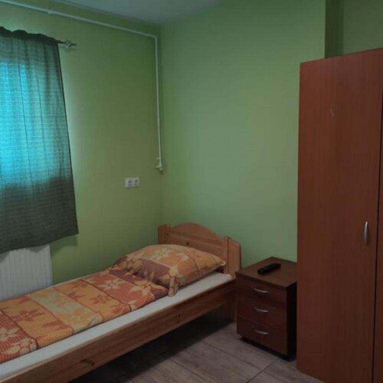 Postel nebo postele na pokoji v ubytování Sanyi Vendégház