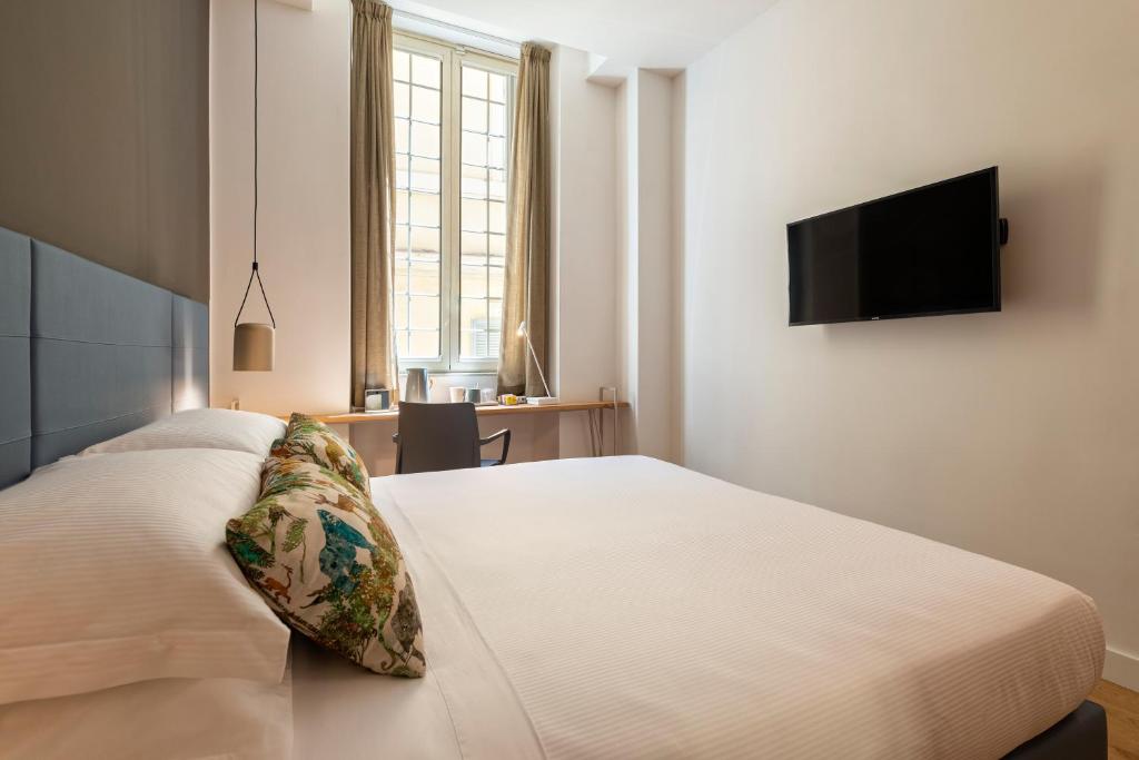 A bed or beds in a room at Giuditta in Trastevere