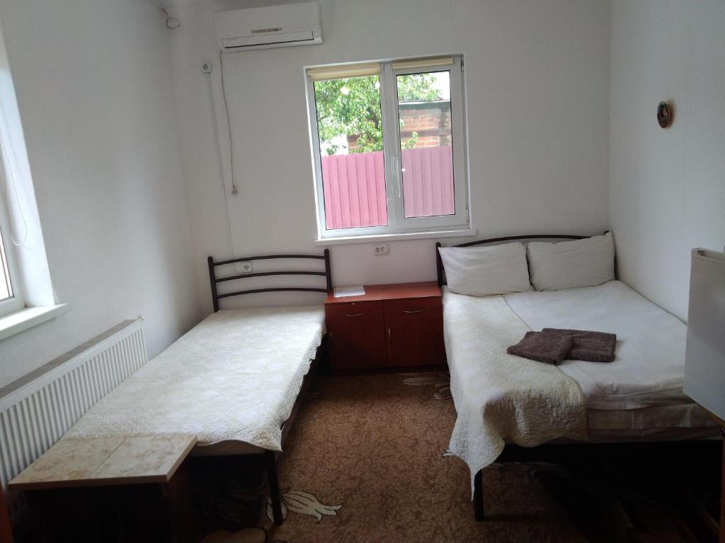 Postel nebo postele na pokoji v ubytování Kak v gostinice