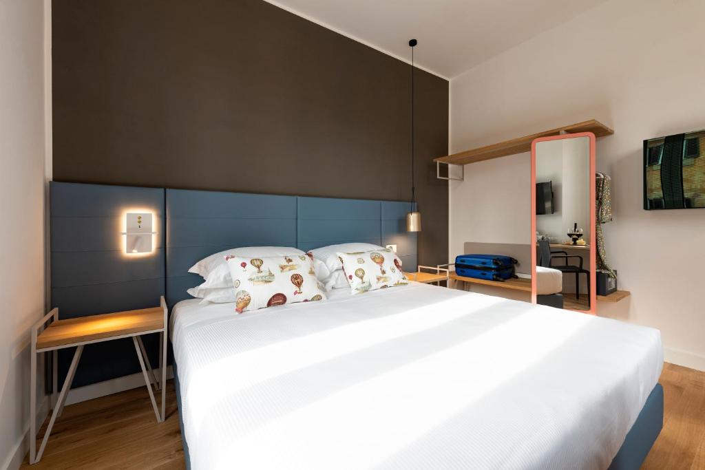 A bed or beds in a room at Giuditta in Trastevere