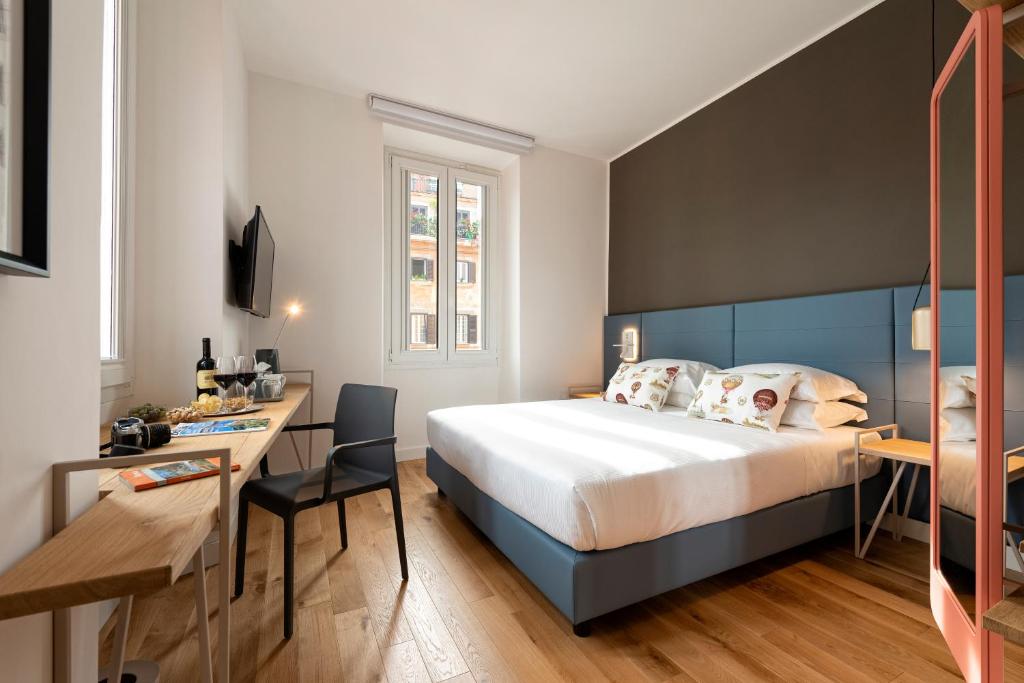 A bed or beds in a room at Giuditta in Trastevere