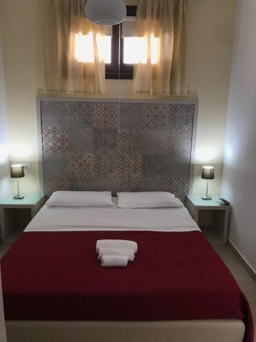 Posteľ alebo postele v izbe v ubytovaní Doride b&b