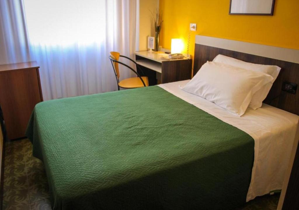 Postel nebo postele na pokoji v ubytování Hotel Centrale