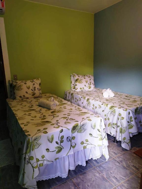 Postel nebo postele na pokoji v ubytování Pousada Nenzinha