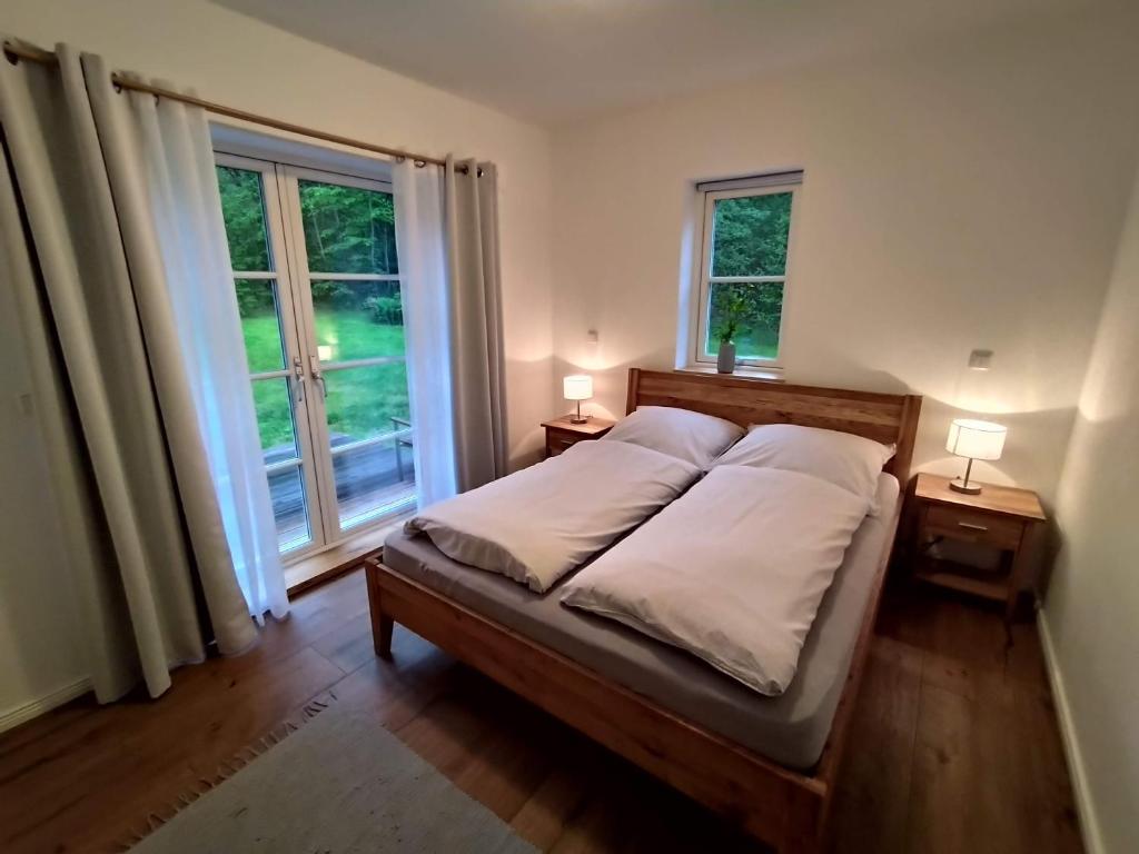 מיטה או מיטות בחדר ב-Ferienhaus Chalet Goldberg