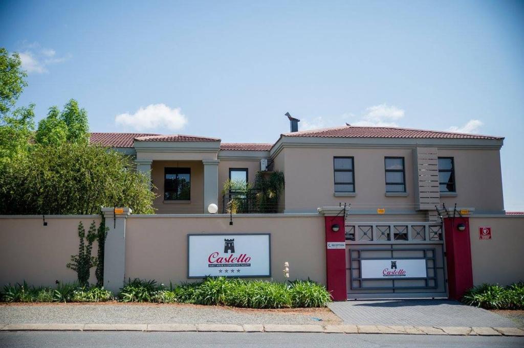 a large house with a caldahl sign on it at Castello Guest House, Bloemfontein in Bloemfontein