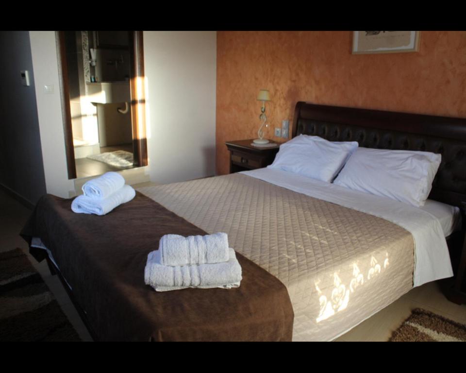 Posteľ alebo postele v izbe v ubytovaní Guesthouse Vavitsas