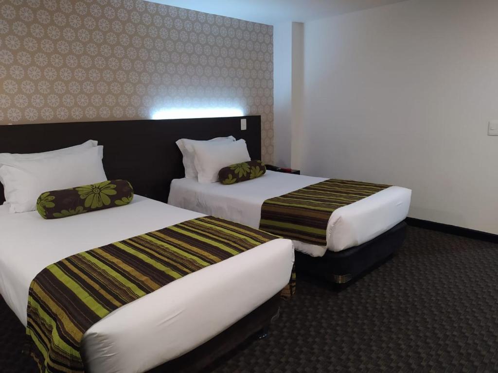 Postel nebo postele na pokoji v ubytování Castellana 95 Bogota By Hoteles Confort 80