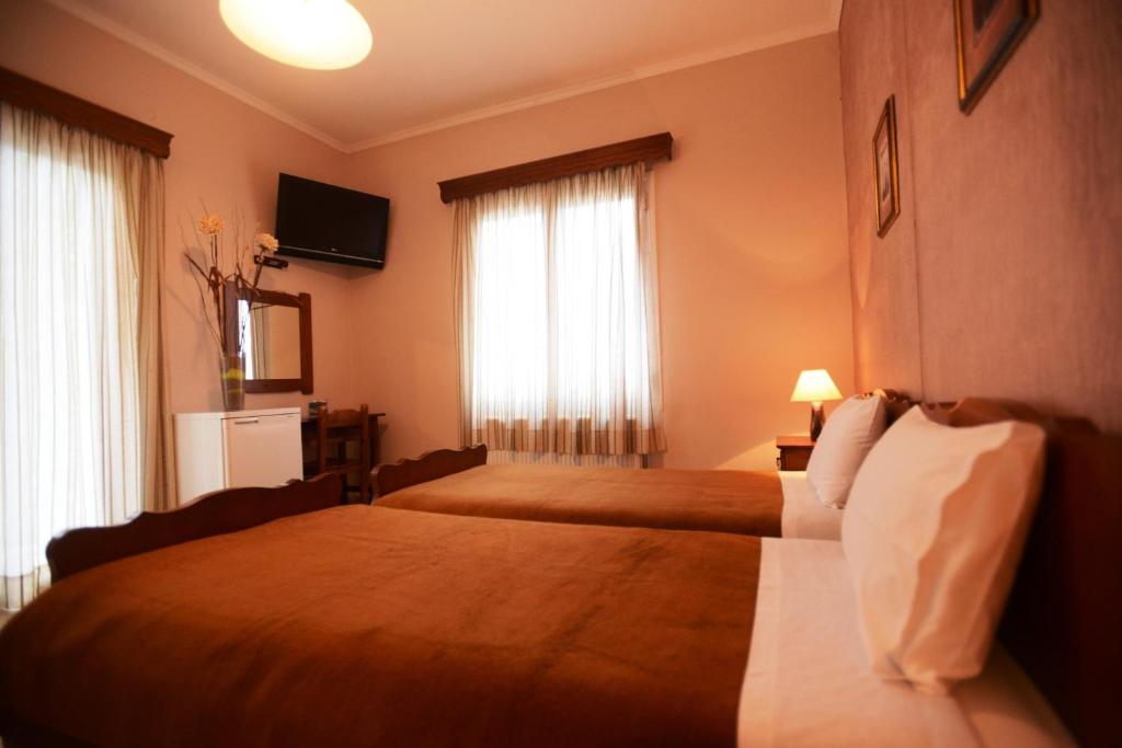 Postel nebo postele na pokoji v ubytování Argo Hotel