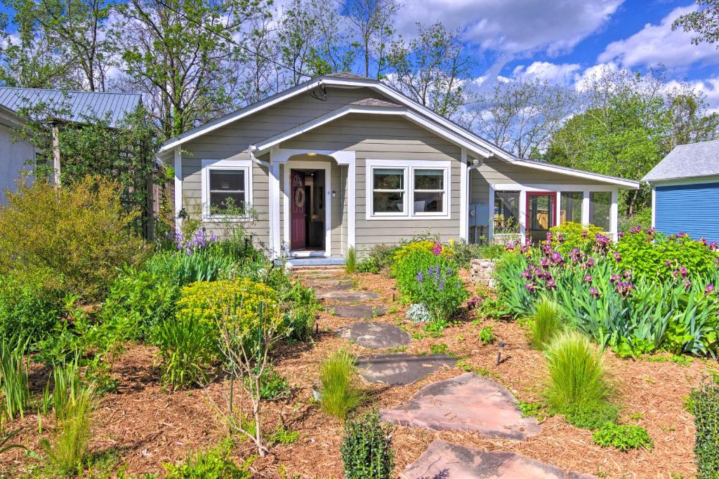 a small house with a garden in front of it at Downtown Brevard Home Walk to Bars and Breweries! in Brevard