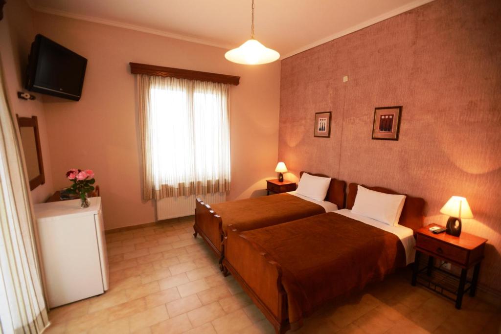 Postel nebo postele na pokoji v ubytování Argo Hotel