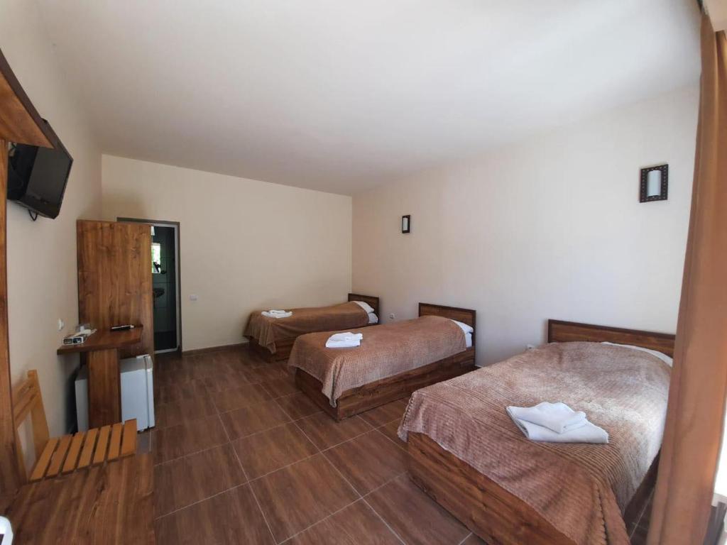 Postel nebo postele na pokoji v ubytování Lucytour Hotel