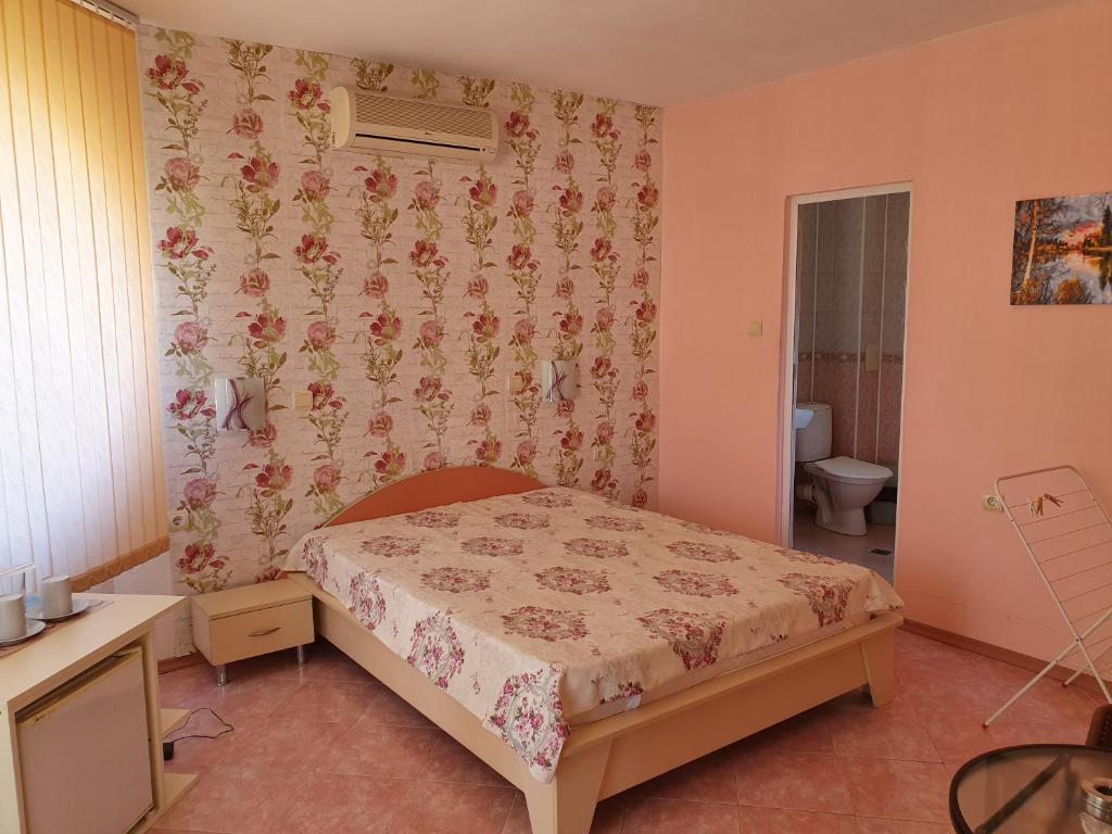 Postel nebo postele na pokoji v ubytování VENIS hotel