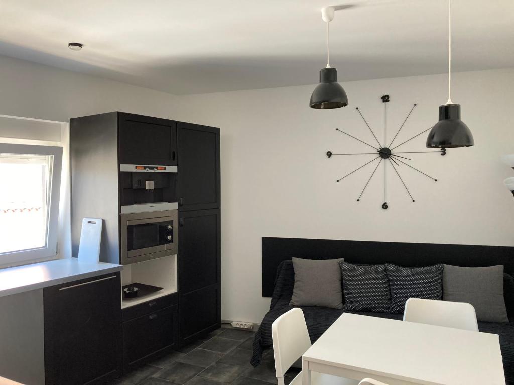 Kuchyňa alebo kuchynka v ubytovaní ASV Apartments