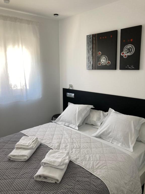 Posteľ alebo postele v izbe v ubytovaní ASV Apartments