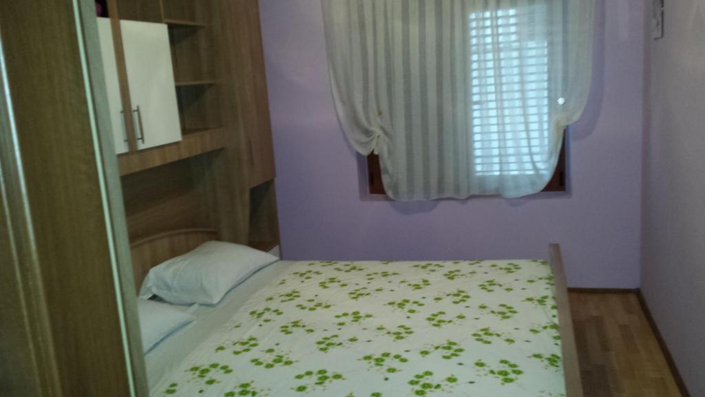 Postel nebo postele na pokoji v ubytování Apartman Krivičić
