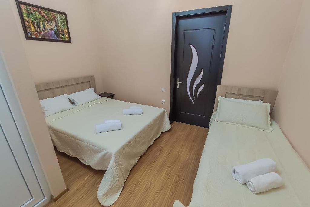 Postel nebo postele na pokoji v ubytování Hotel Pushkin II/1a