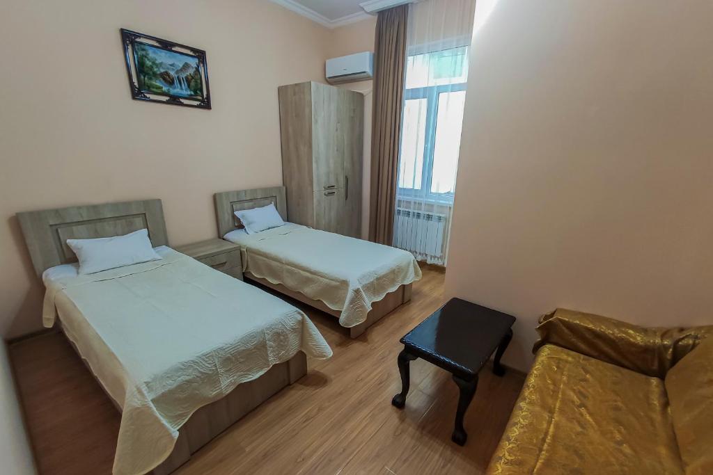 Postel nebo postele na pokoji v ubytování Hotel Pushkin II/1a