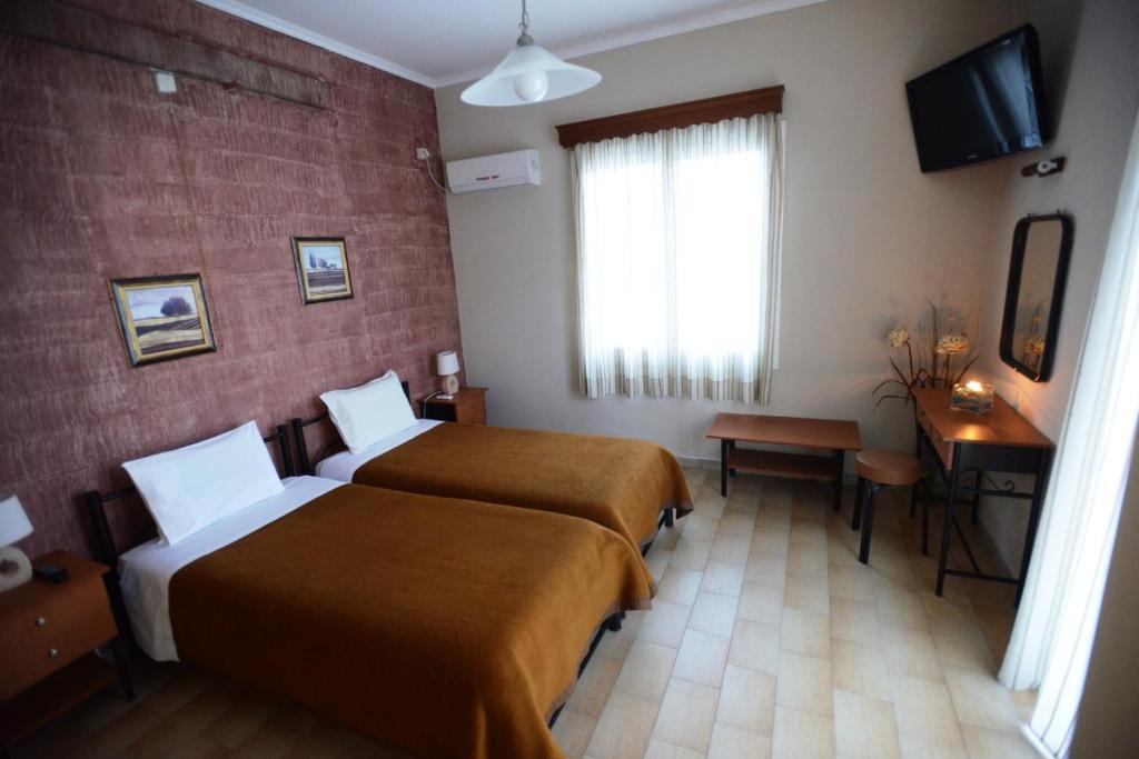 Postel nebo postele na pokoji v ubytování Argo Hotel