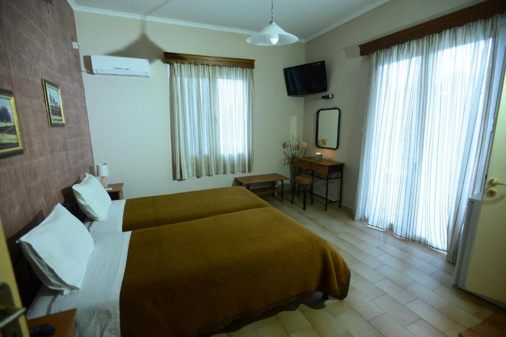 Postel nebo postele na pokoji v ubytování Argo Hotel