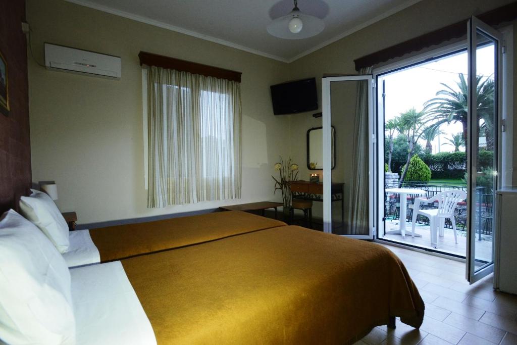 Postel nebo postele na pokoji v ubytování Argo Hotel