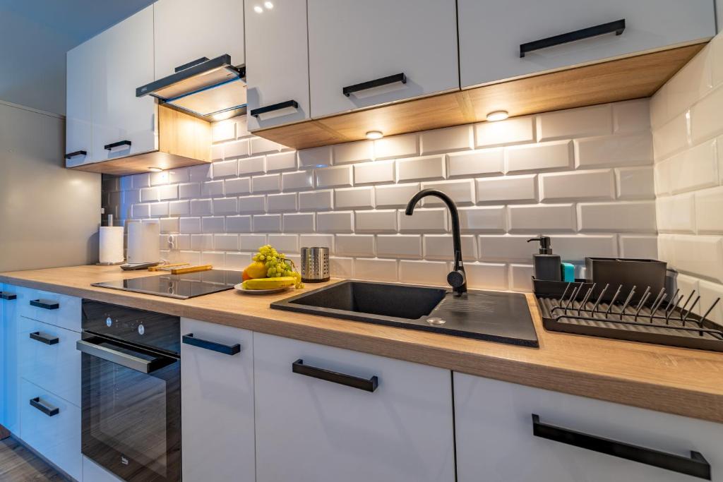 Kuchyňa alebo kuchynka v ubytovaní Apartamenty Bunny Aparts