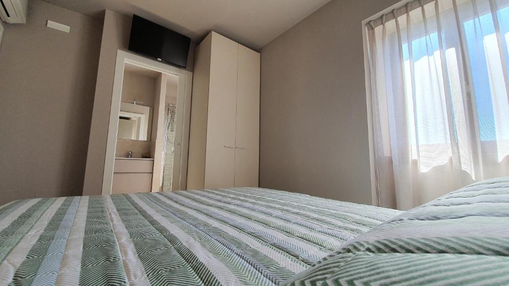 Postel nebo postele na pokoji v ubytování Appartamenti Moonlight