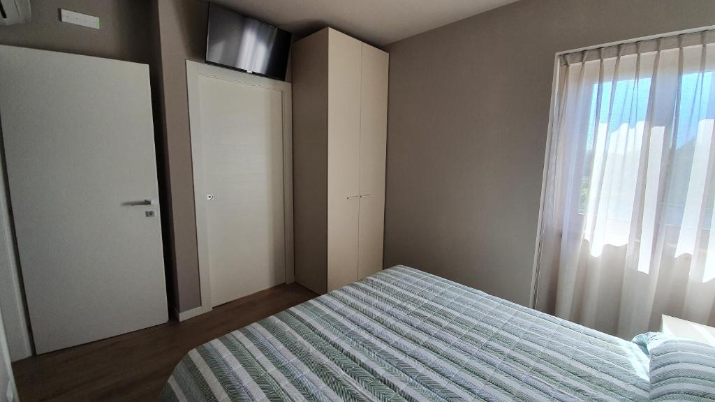 Postel nebo postele na pokoji v ubytování Appartamenti Moonlight