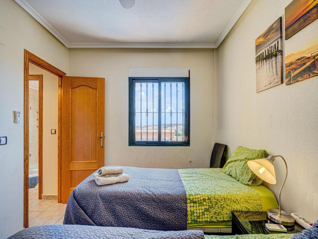 Postel nebo postele na pokoji v ubytování Casa vacanze a Orihuela con giardino