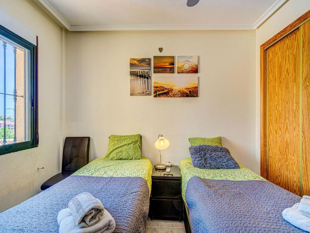 Postel nebo postele na pokoji v ubytování Casa vacanze a Orihuela con giardino