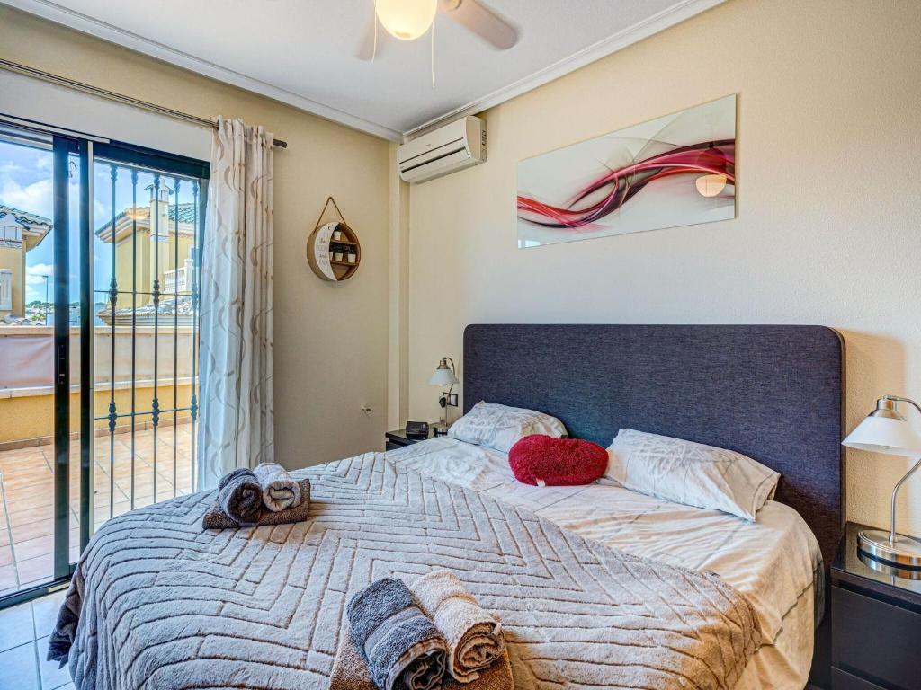 Postel nebo postele na pokoji v ubytování Casa vacanze a Orihuela con giardino
