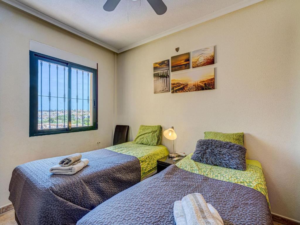 Postel nebo postele na pokoji v ubytování Casa vacanze a Orihuela con giardino