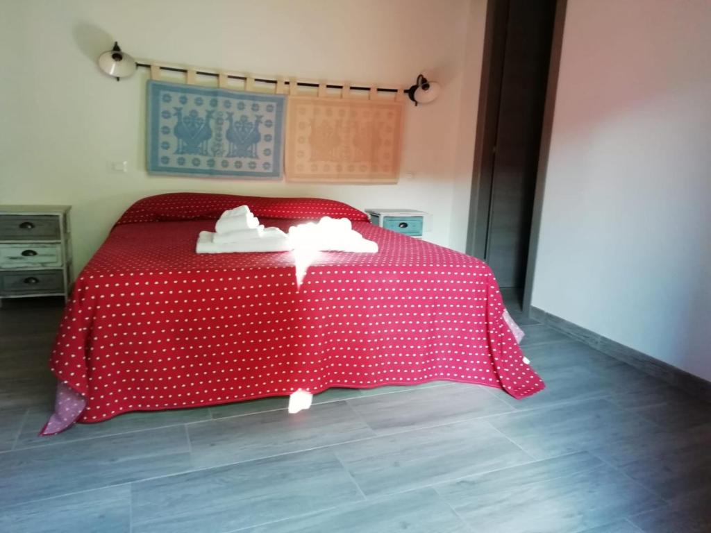 Postel nebo postele na pokoji v ubytování S'apposenteddu Affittacamere del Ristorante da Stefano