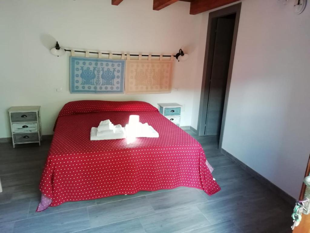 Postel nebo postele na pokoji v ubytování S'apposenteddu Affittacamere del Ristorante da Stefano