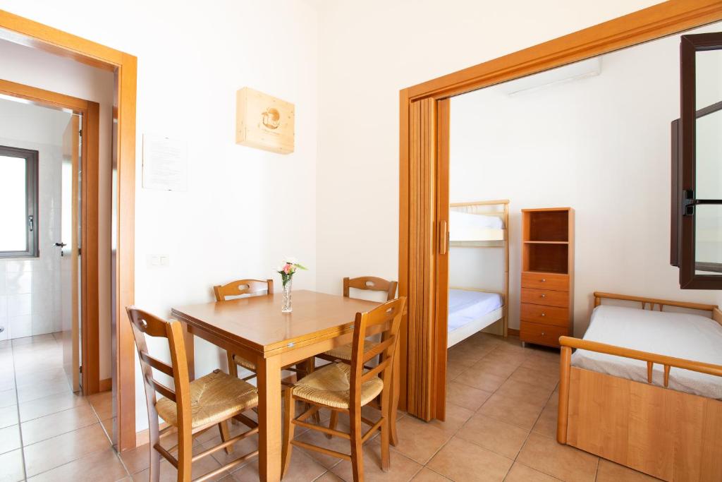 Łóżko lub łóżka w pokoju w obiekcie Villaggio Camping Oasi