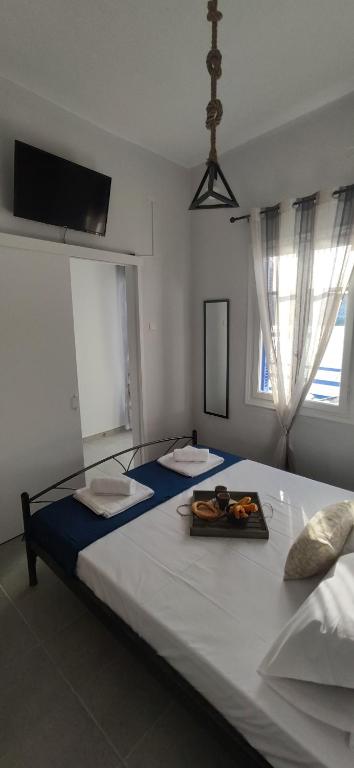 A bed or beds in a room at Batsi Bay Premium