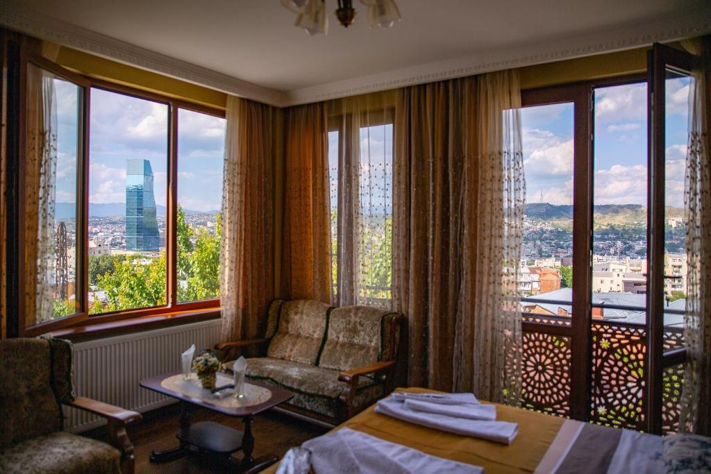 a hotel room with a view of the city at Family Hotel Kolorit Old Tbilisi in Tbilisi City