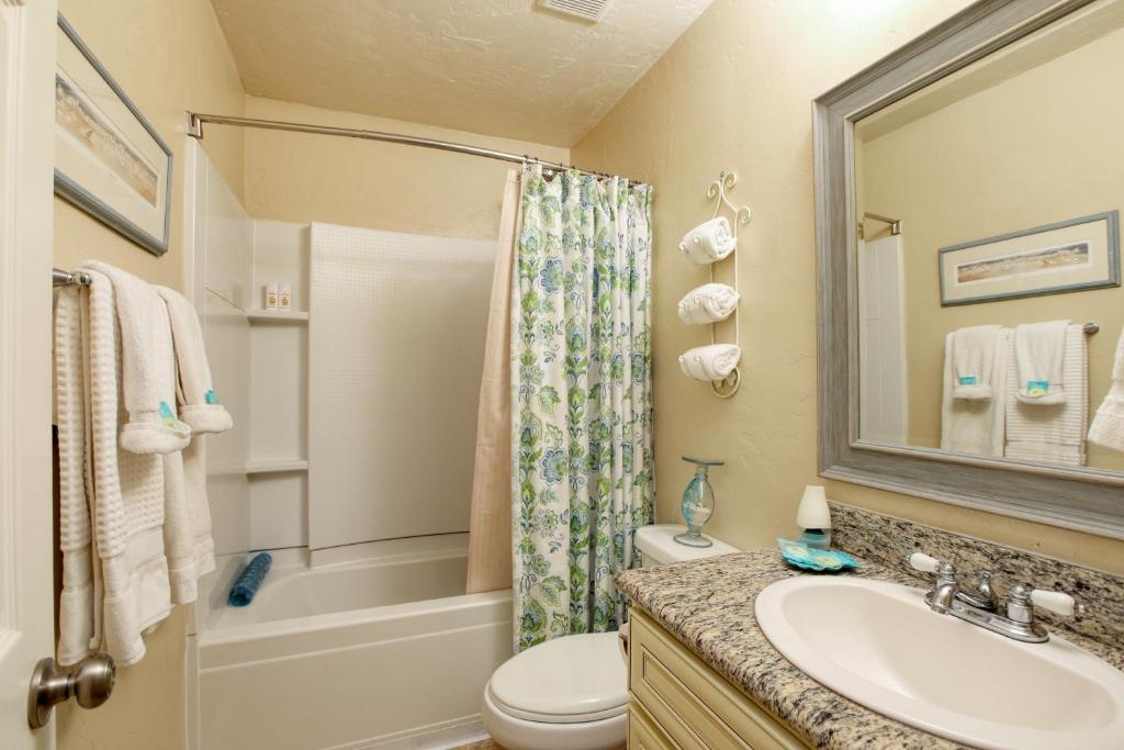 a bathroom with a sink and a toilet and a shower at 432 Saratoga in Grover Beach