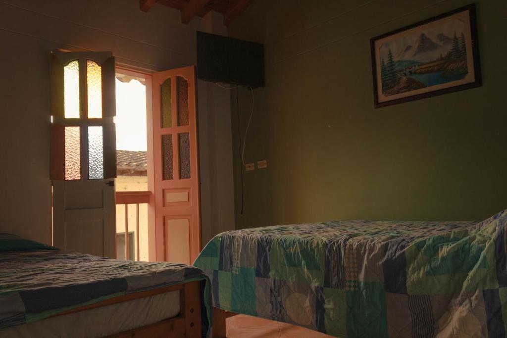 Postel nebo postele na pokoji v ubytování Hotel Felicina