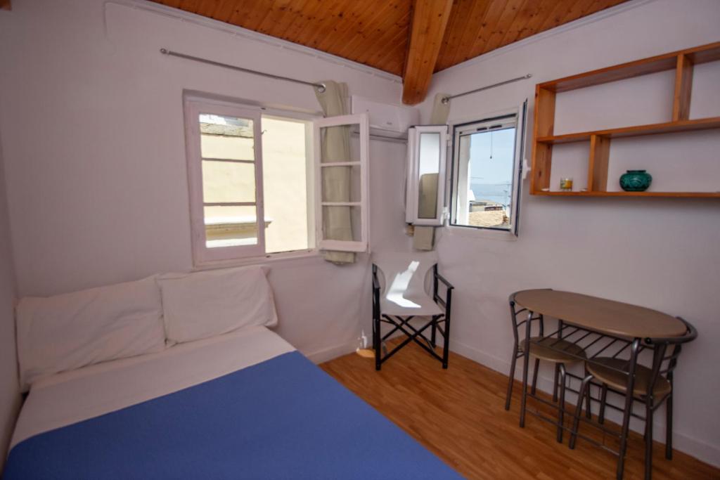 A bed or beds in a room at Studio attic in Corfu Town centre