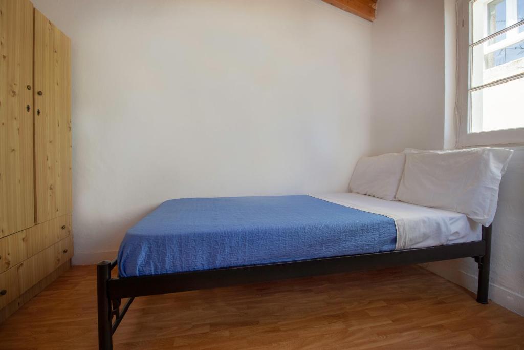 A bed or beds in a room at Studio attic in Corfu Town centre